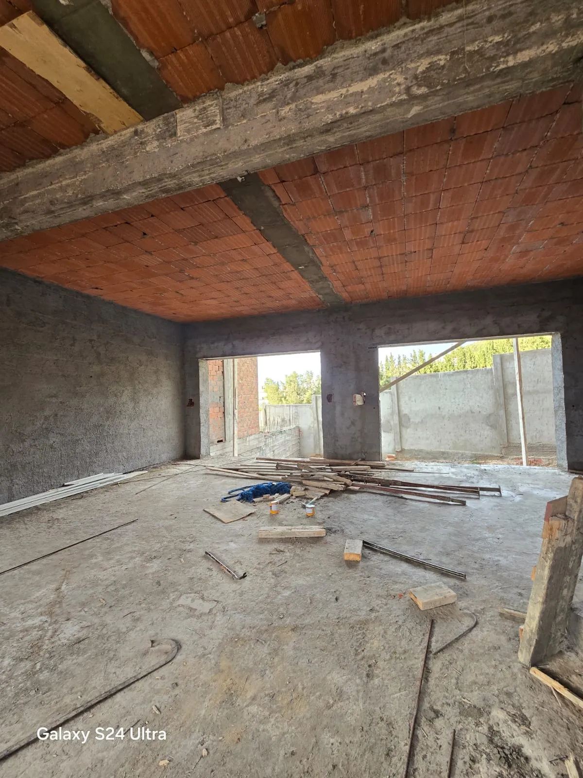 Rendu 3D du séjour d’une maison conçue par Armonia — état initial, vue 1
